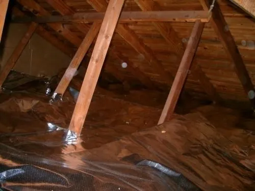 Ra-flect radiant barrier laid over insulation on an attic floor