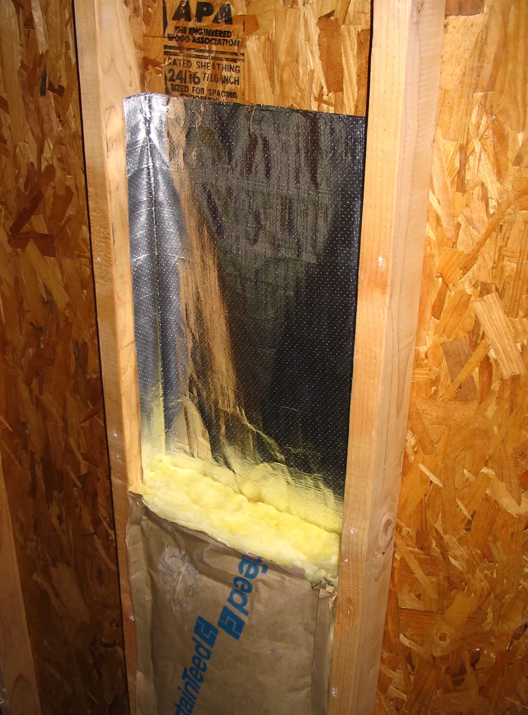 Ra-flect radiant barrier installed between studs in a knee-wall assembly